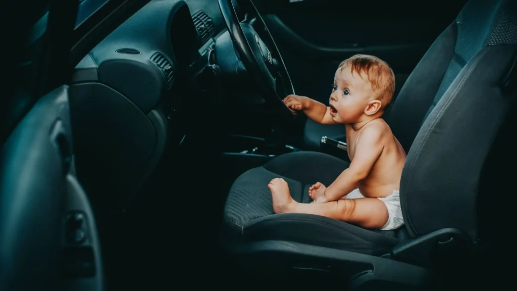 baby seating in a car seat